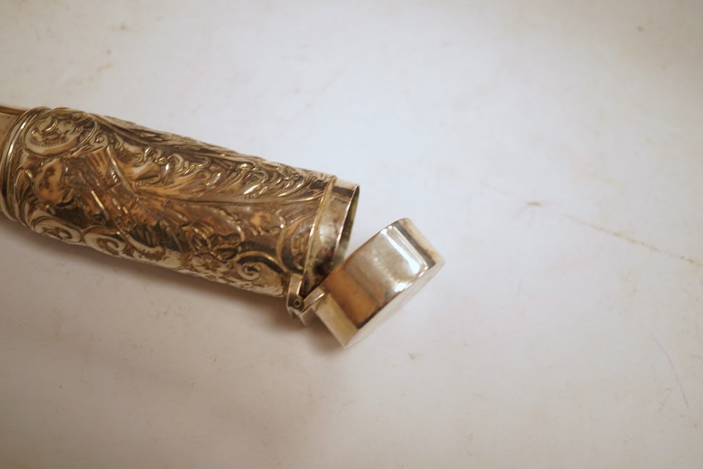 A small quantity of assorted silver including a Victorian sauceboat, London, 1851, length 12.6cm, a sugar bowl, a tea strainer on stand, mustard pot and ladle, three mounted brushes, a salt, pieced bonbon dish and a case